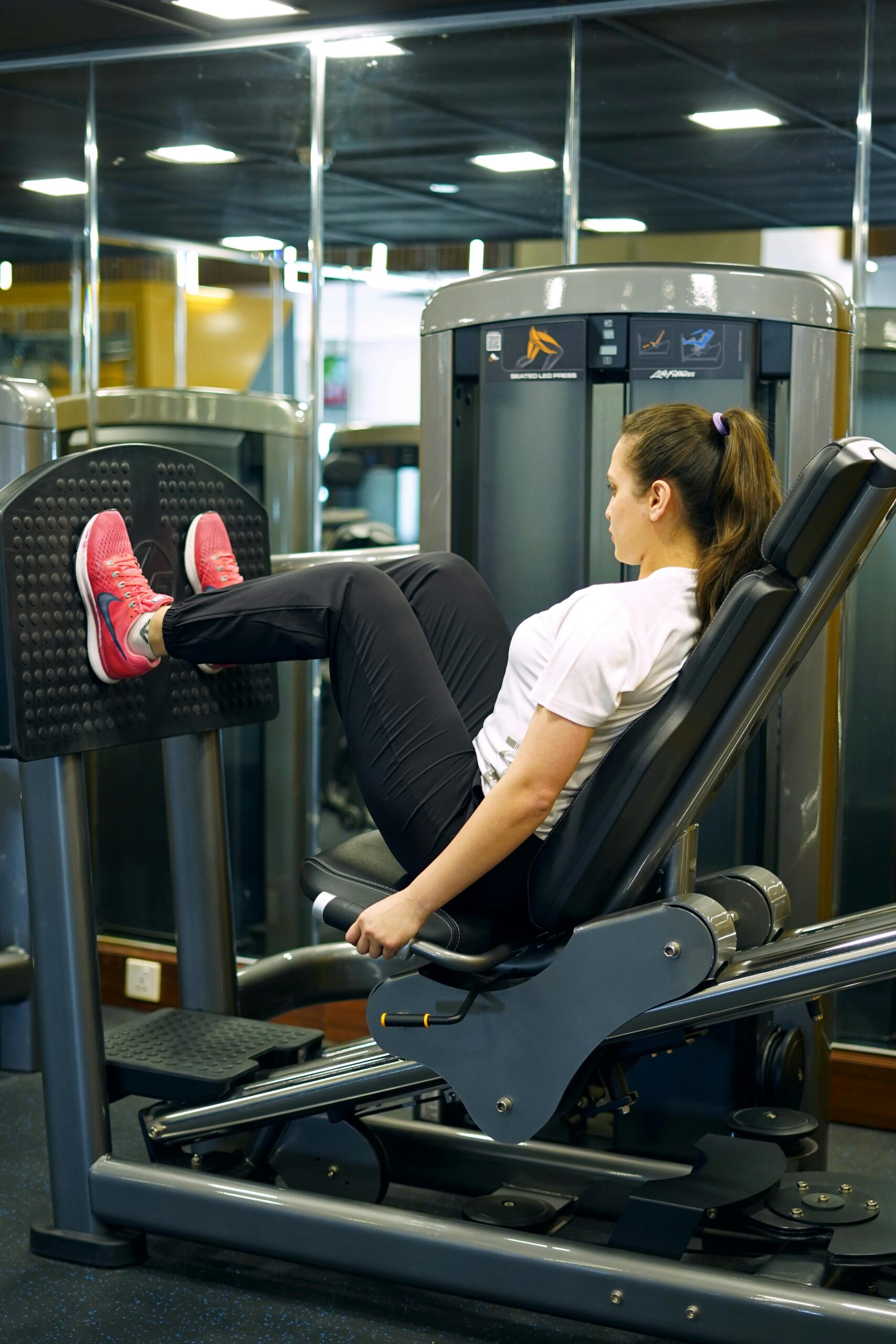 Woman using a fitness machine