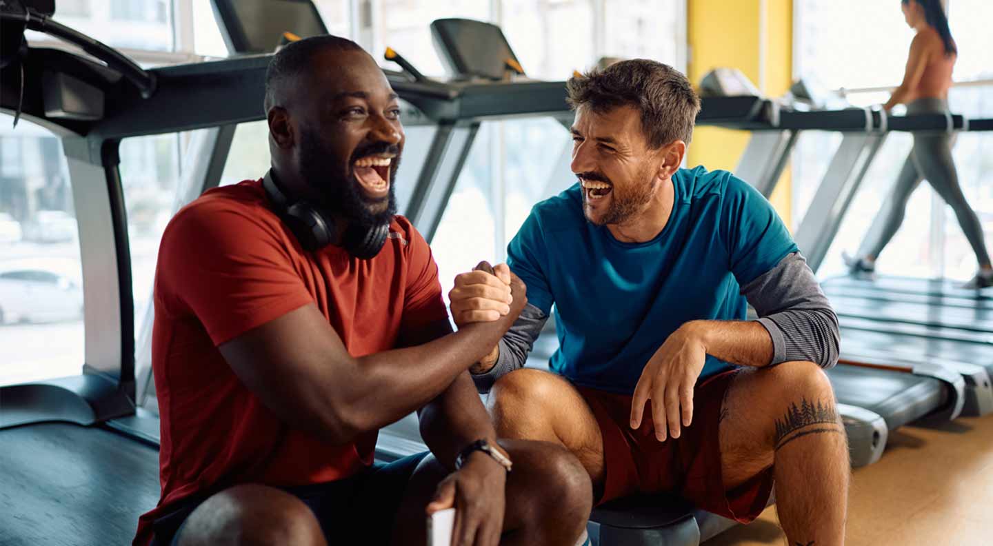 Two male friends at an Oldham Gym - laughing